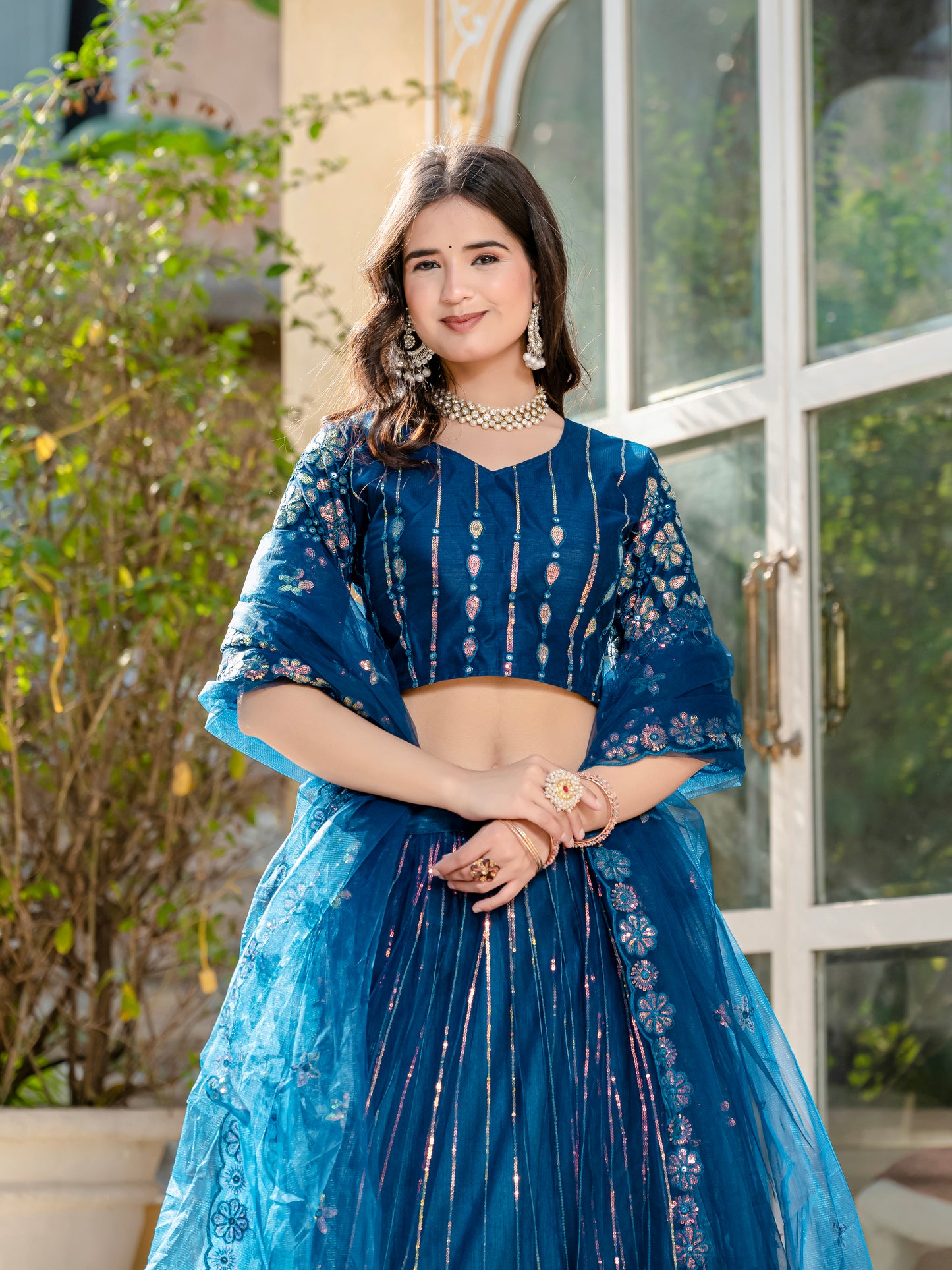 Exquisite Rama Blue Net Lehenga Choli with Sequin & Thread Embroidery