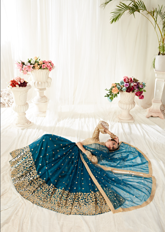Heavy Sequined and Embroidered Soft Net Lehenga Choli in Mauve-Pink